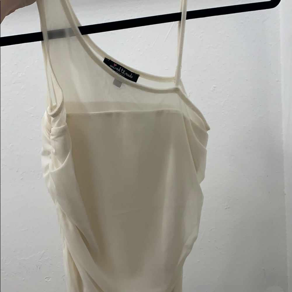 Cream colored tight crop top shirt